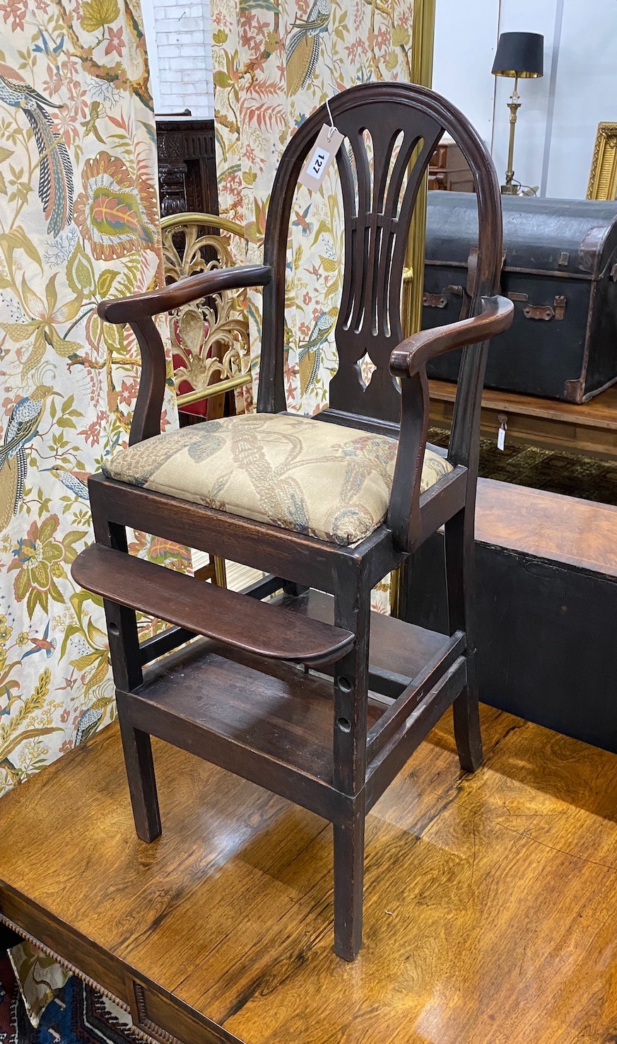 A 19th century mahogany child's chair on stand, width 94cm